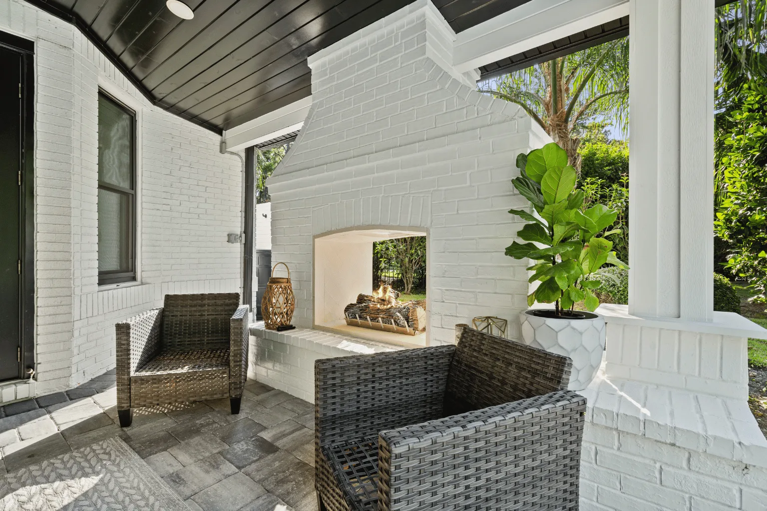 Covered patio installation with outdoor fireplace and paver flooring by Jax Pavers in Jacksonville FL