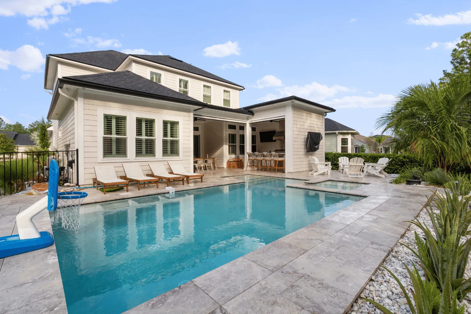 Paver pool deck installation with covered lanai and outdoor kitchen by Jax Pavers in Jacksonville FL