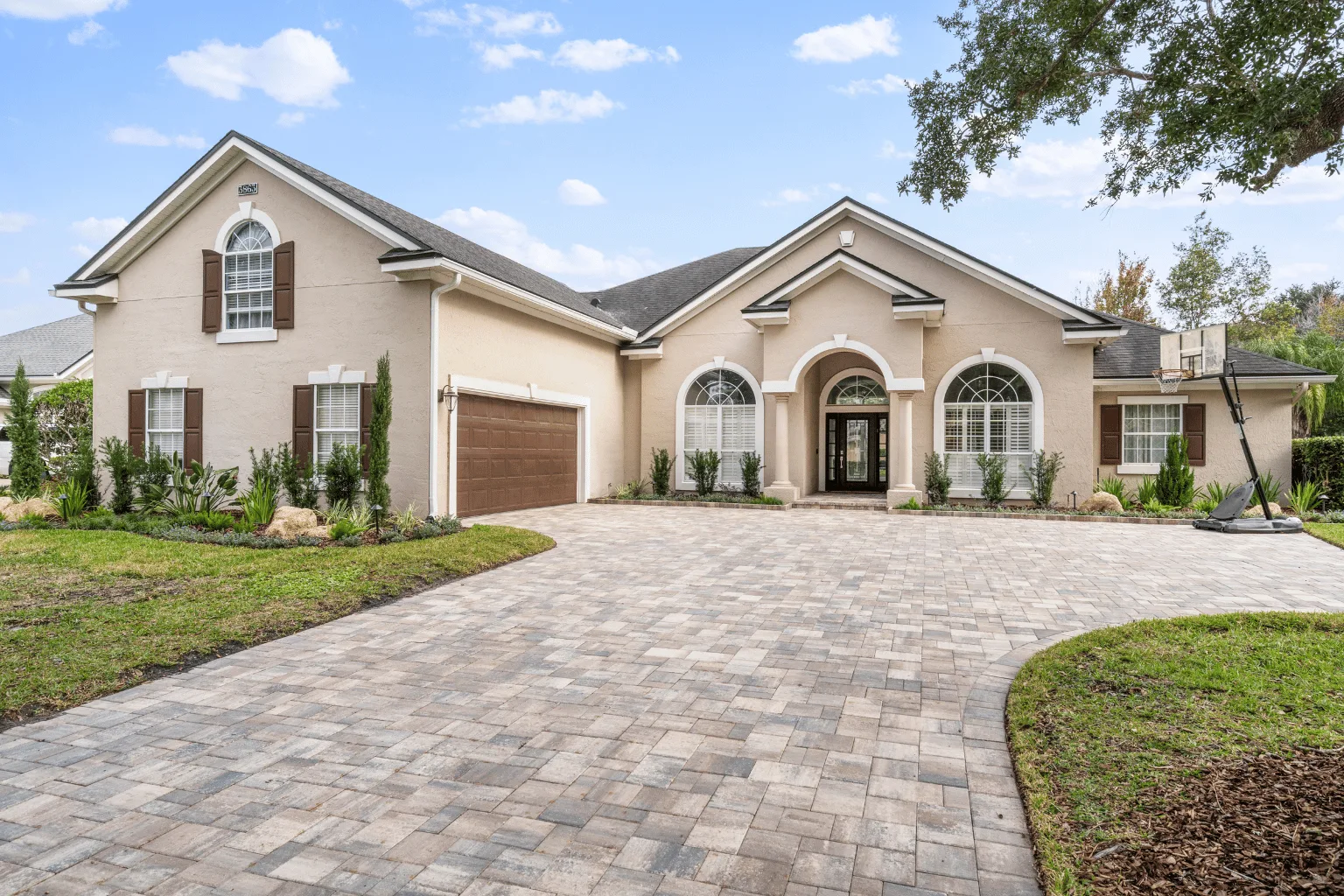 Running bond paver driveway installation in gray tones by Jax Pavers in Jacksonville FL